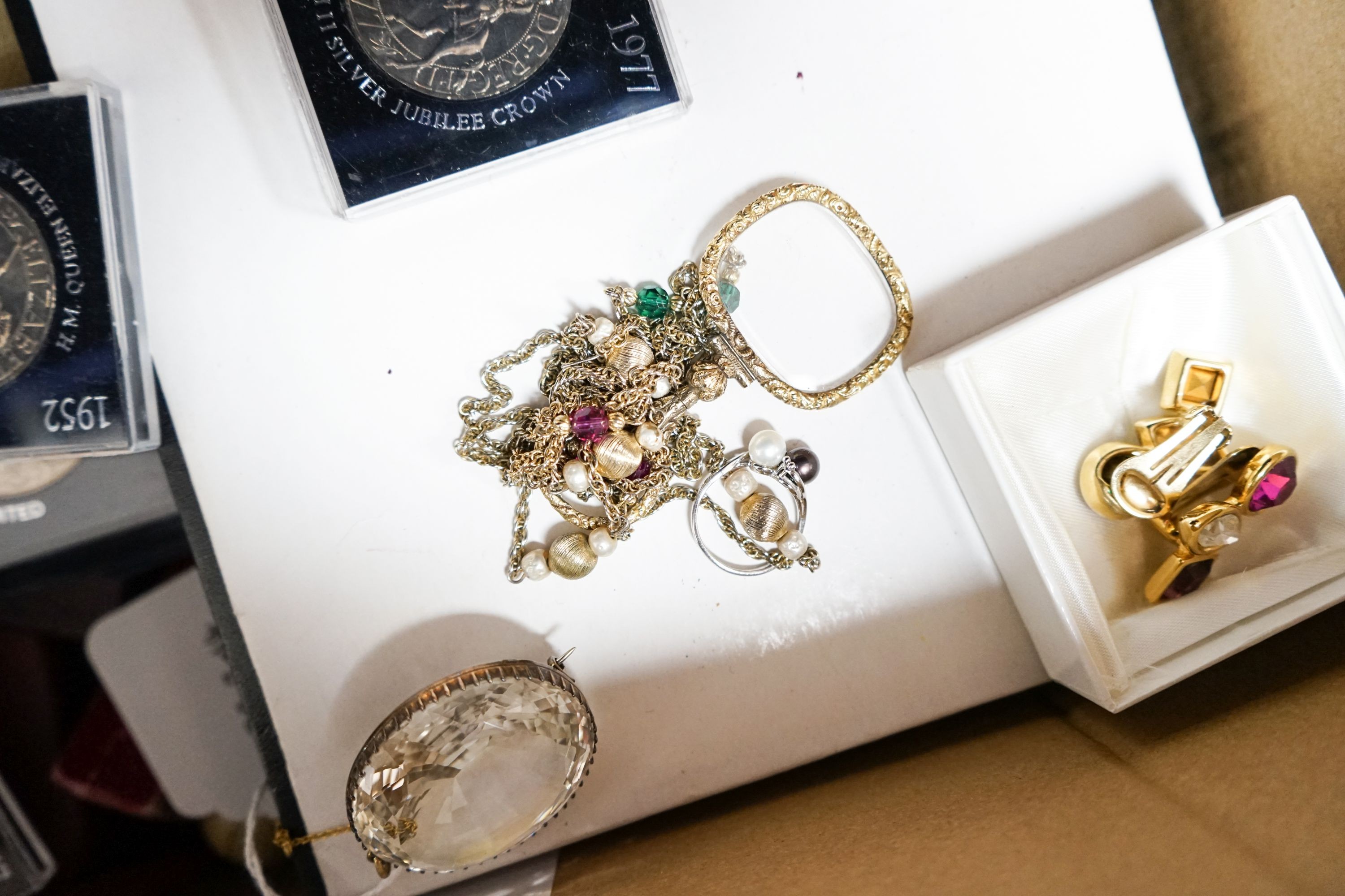 A group of assorted costume jewellery etc. including some small silver, a 9ct gold and two stone cultured pearl crossover ring, a yellow metal overlaid spy glass, commemorative coins and a large yellow metal mounted oval